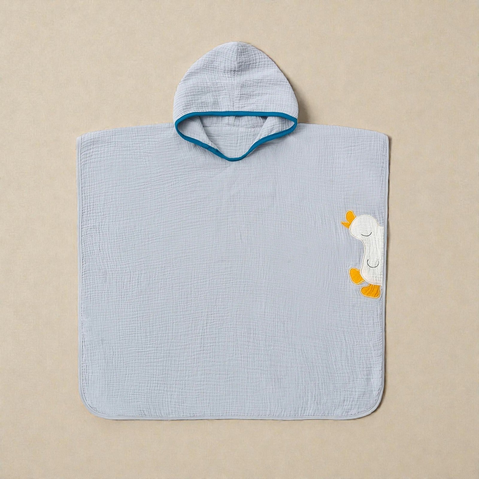 Cape de bain enfant en mousseline bleu clair